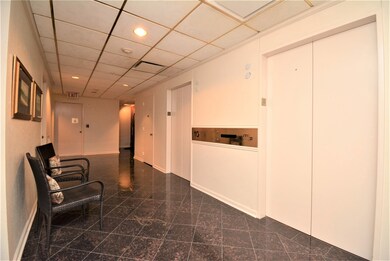 The 10th floor elevator lobby. Unit 10A is down th