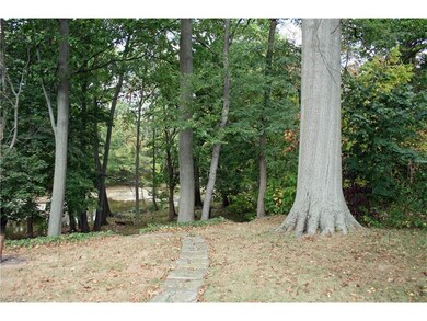 Walkway leads to steps that go down to level area.