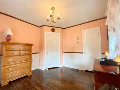 Bedroom two with hardwood and closet.