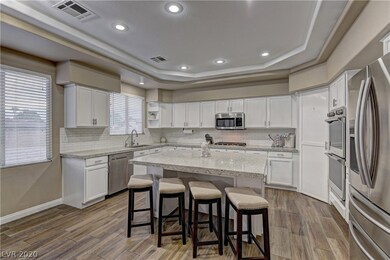 KITCHEN WITH QUARTZ COUNTERS.
