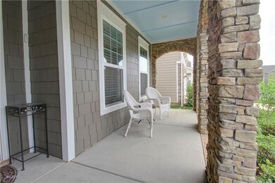 FRONT PORCH: Relaxing covered front porch accented