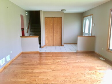 View of living room looking toward foyer and upper