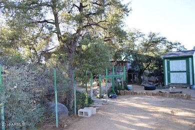 Fenced Parking Area and Storage Shed
