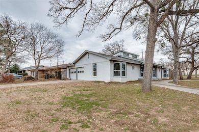View of front facade with a garage and a front yar