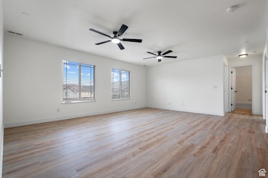 Living room with new luxury vinyl plank flooring and ceiling fans