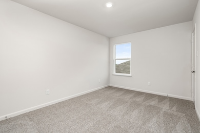 Spare room with carpet flooring and baseboards