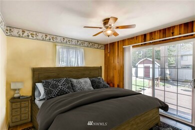 1 of 2 main floor bedrooms...sliding door to the backyard.  Also a door to backyard from utility room.