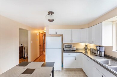 Kitchen looking into hall and living room.