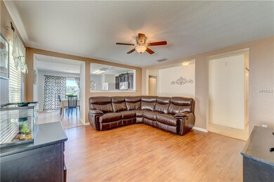 Walking in front door, thru foyer to living room.