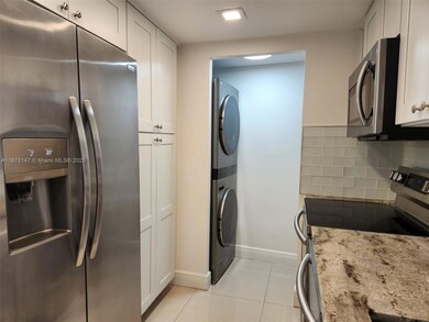 In unit washer and dryer adjacent to the kitchen.