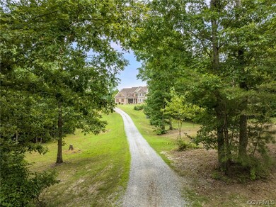 Secluded, tree lined drive up to the house