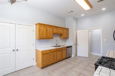 Kitchen with large separate laundry room