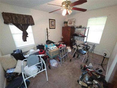 Bedroom with carpet and a ceiling fan
