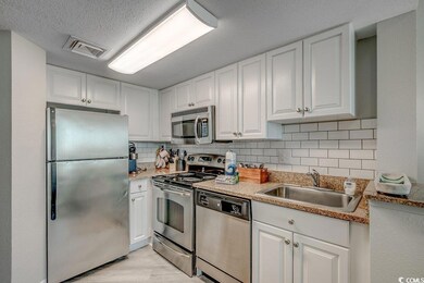 Kitchen featuring sink, stainless steel appliances