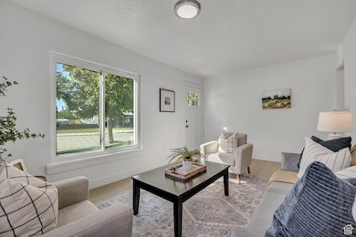 Living room featuring wood finished floors and baseboards