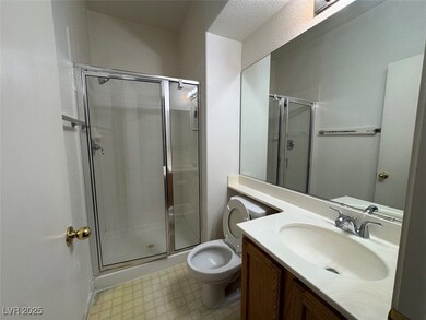 Bathroom featuring vanity and a stall shower