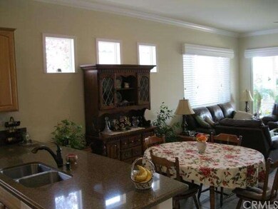 Open with plenty of Lighting and Crown Molding.