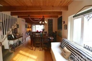 Welcoming floor plan upon entrance with exposed wo