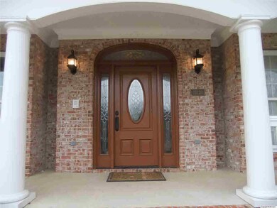 This beautiful columned entry says 