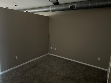 Spare room featuring carpet flooring
