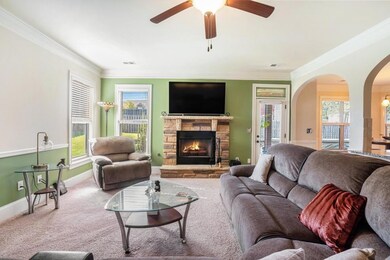 Fireside Family Room, complete with a Stone Fireplace a cozy spot for movie nights or relaxing evenings.