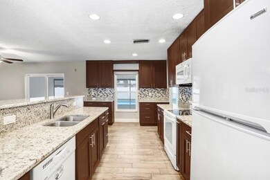 Kitchen with beautiful 42 inch cabinets, granite countertops and beautiful backsplash