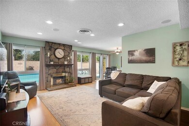 Living Room w Fireplace to Pool
