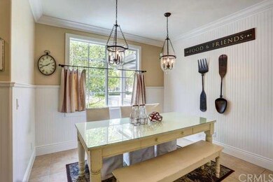 Formal dining room with wainscoting and encased wi