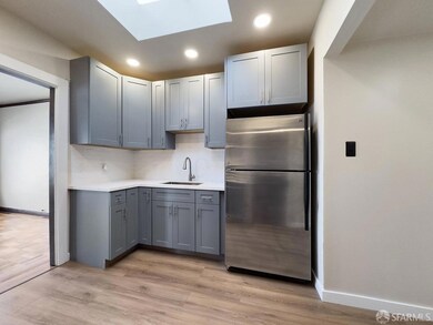 Skylight over the kitchen provides warm natural li