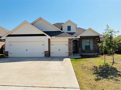 Craftsman inspired home featuring a garage and a f