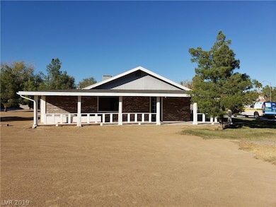 Left side of the home. Wrap around porch. Entrance
