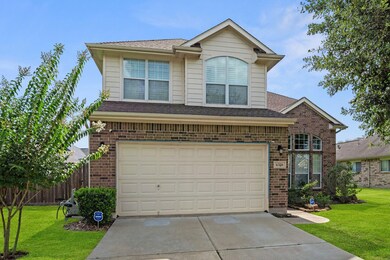 Charming curb appeal with a brick façade and a two