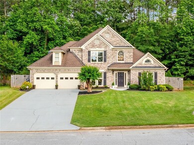 View of front of property with driveway, an attach