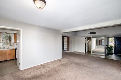 living looking back to entry and kitchen