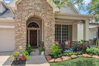 The front of this home has charming stacked stone and offers a spacious covered porch.