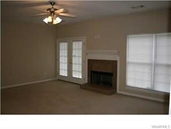 The great room with fireplace and french doors out