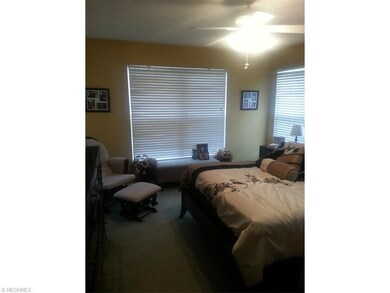 Master bedroom with wall to wall carpet, ceiling f