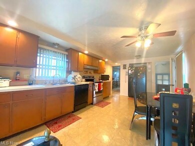 Kitchen with brown cabinets, light countertops, di