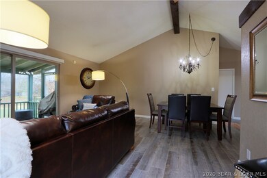 Large dining room table.  Chic floor lamps.