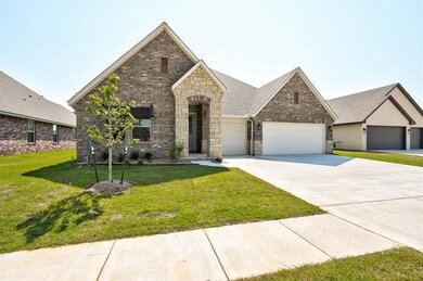 View of front of property with a garage and a fron