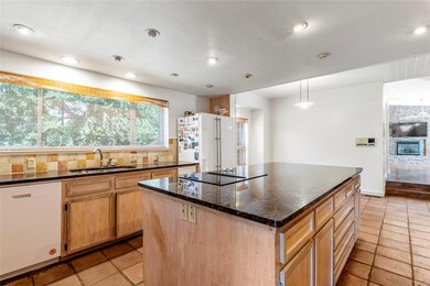 Kitchen with tasteful backsplash, white appliances