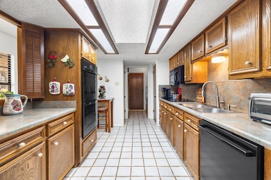 kitchen looking towards laundry and garage