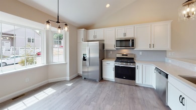 SIMILAR UNIT KITCHEN AREA WITH STAINLESS STEEL WHIRLPOOL APPLIANCES