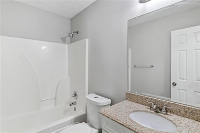 Full bathroom with vanity and tub / shower combination
