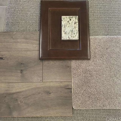 Wood laminate and carpet samples paired with Maple