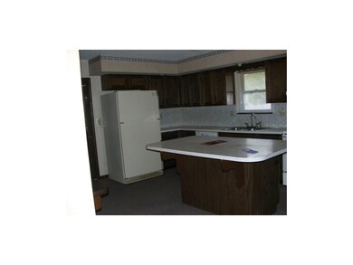Kitchen has a large counter /breakfast bar, plus a