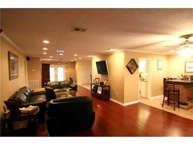 Living Room. Wide open floor plan with wood and ti