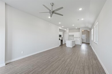 Unfurnished living room with light wood-style flo