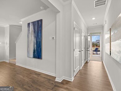 Sudbury townhome front entry hallway open to the living area