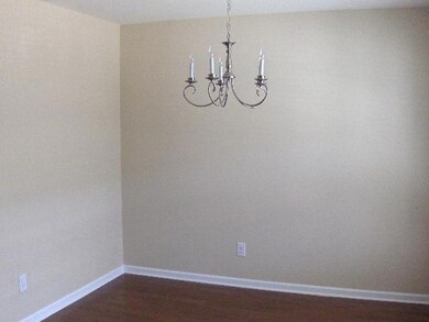 Dining room with upgraded hardwood floors.